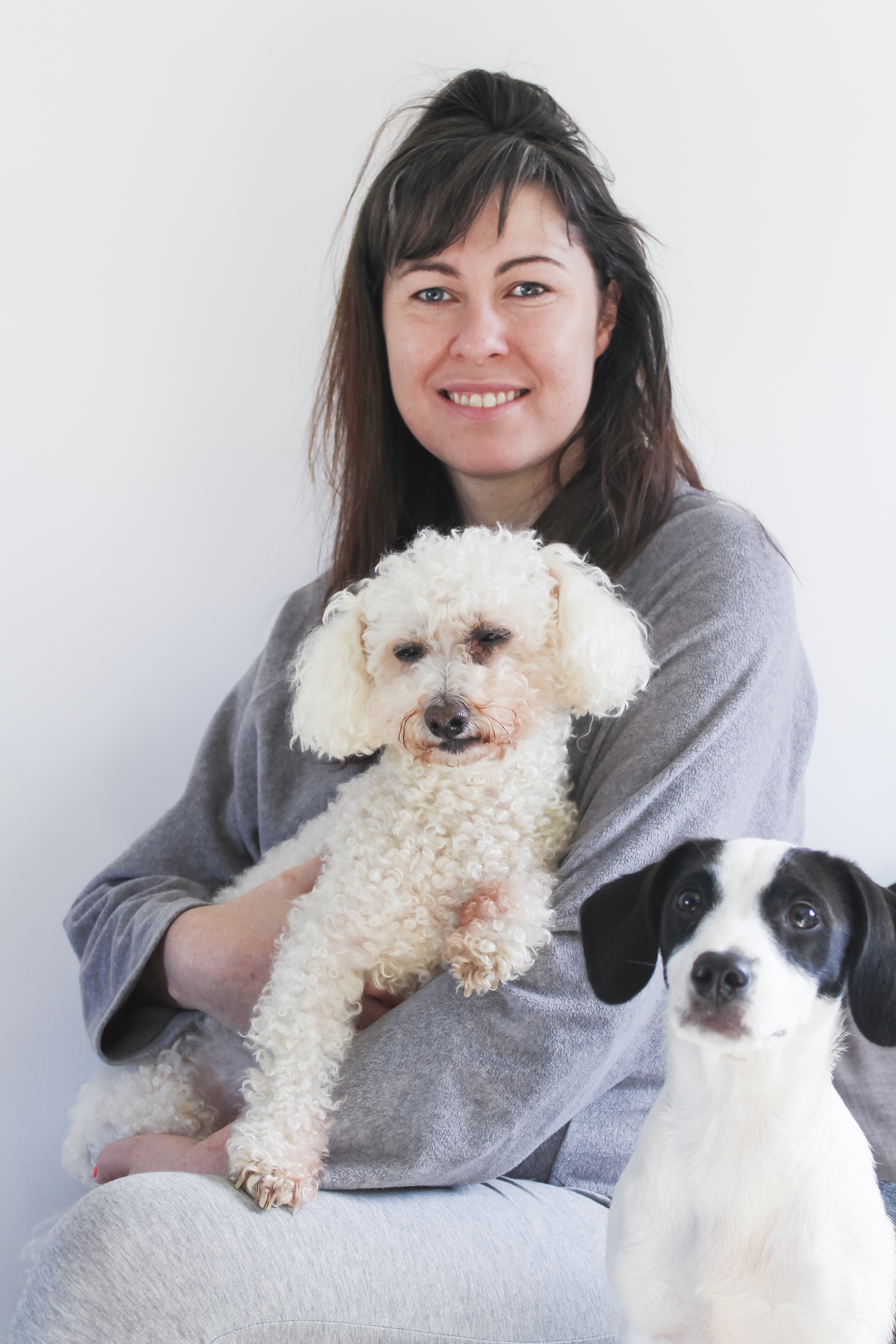 Jamie Lee holding her dogs