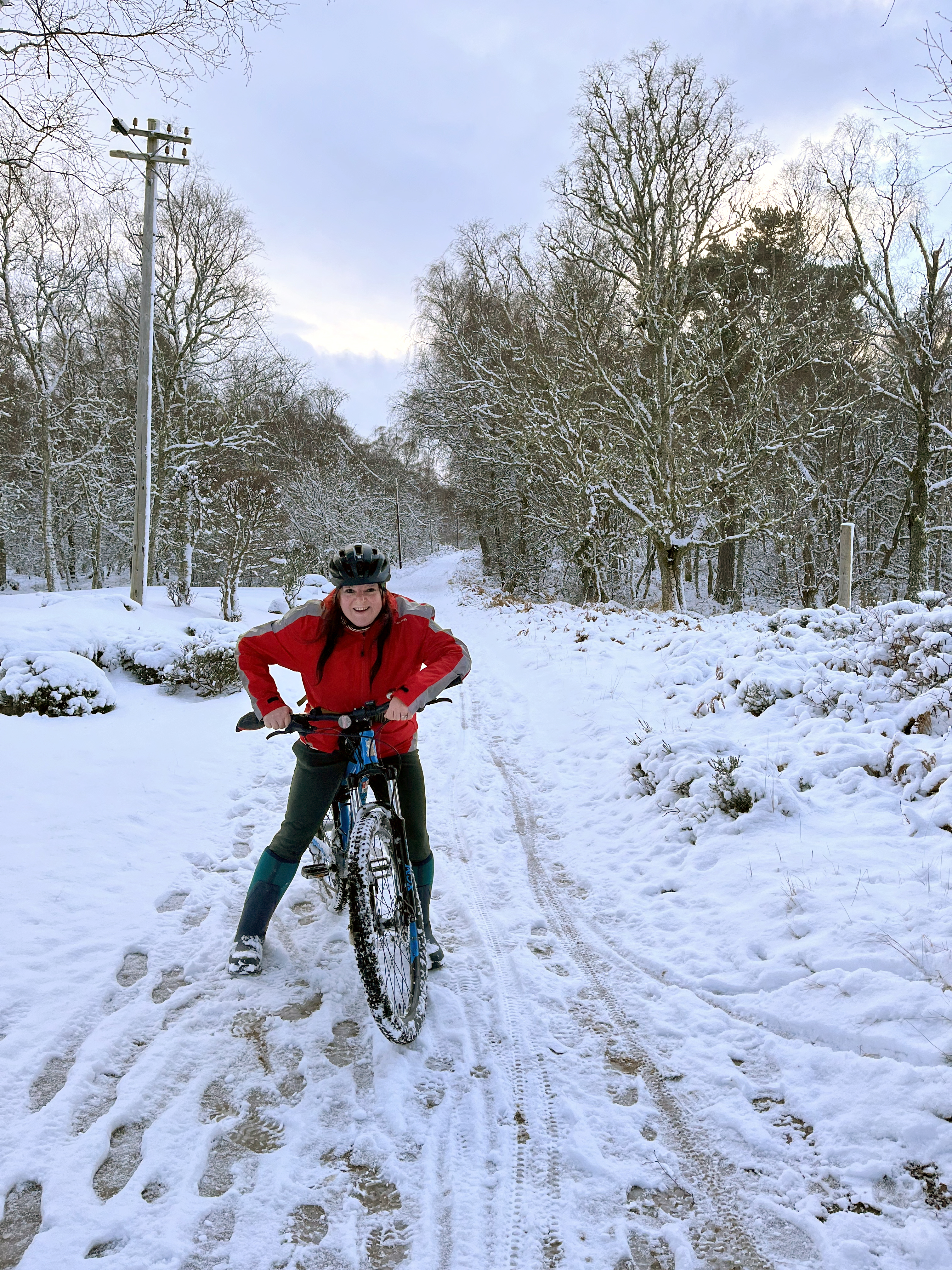 Marie on her bike in the snow
