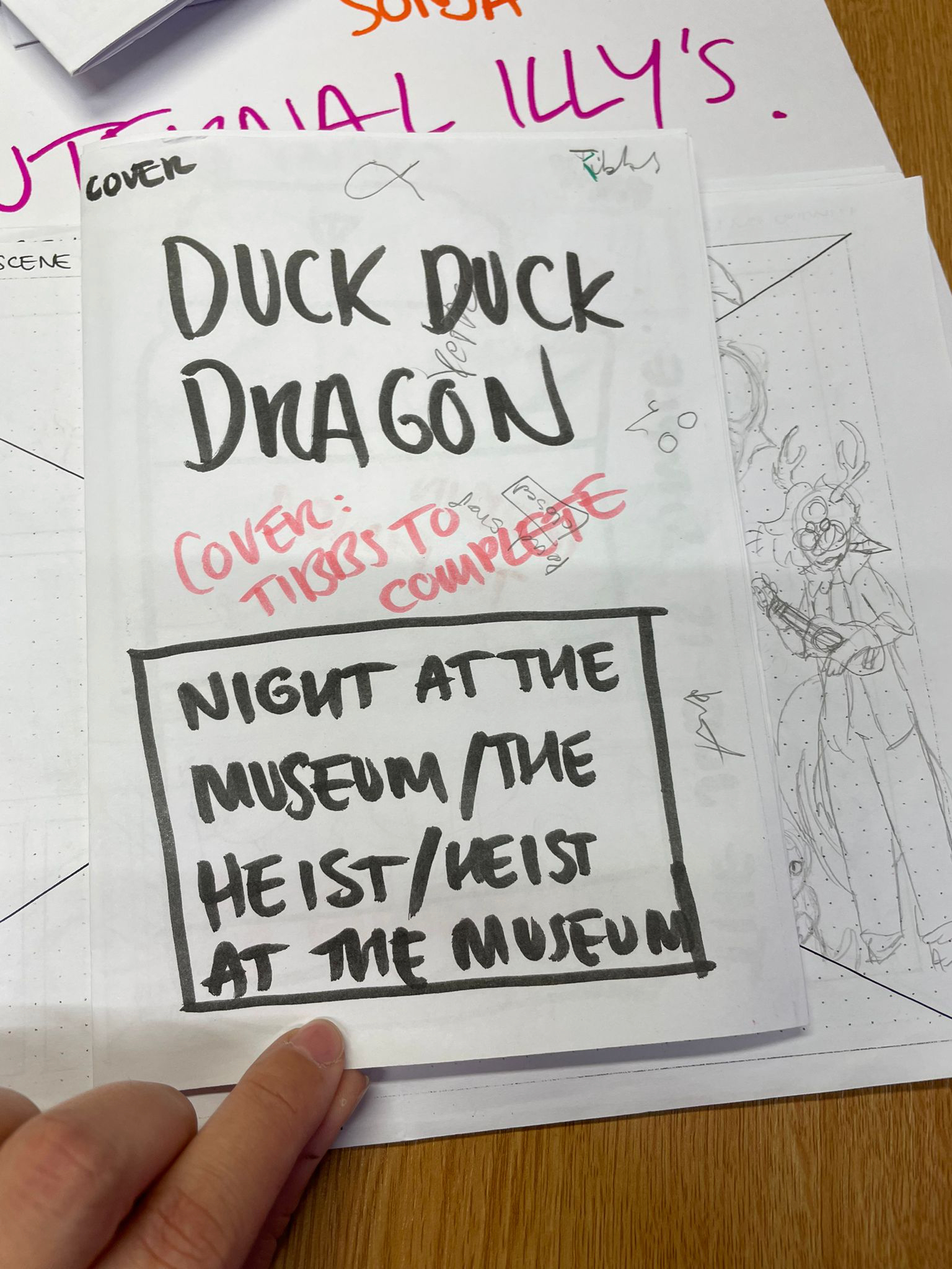 paper with drawings and notes on it in black and red ink