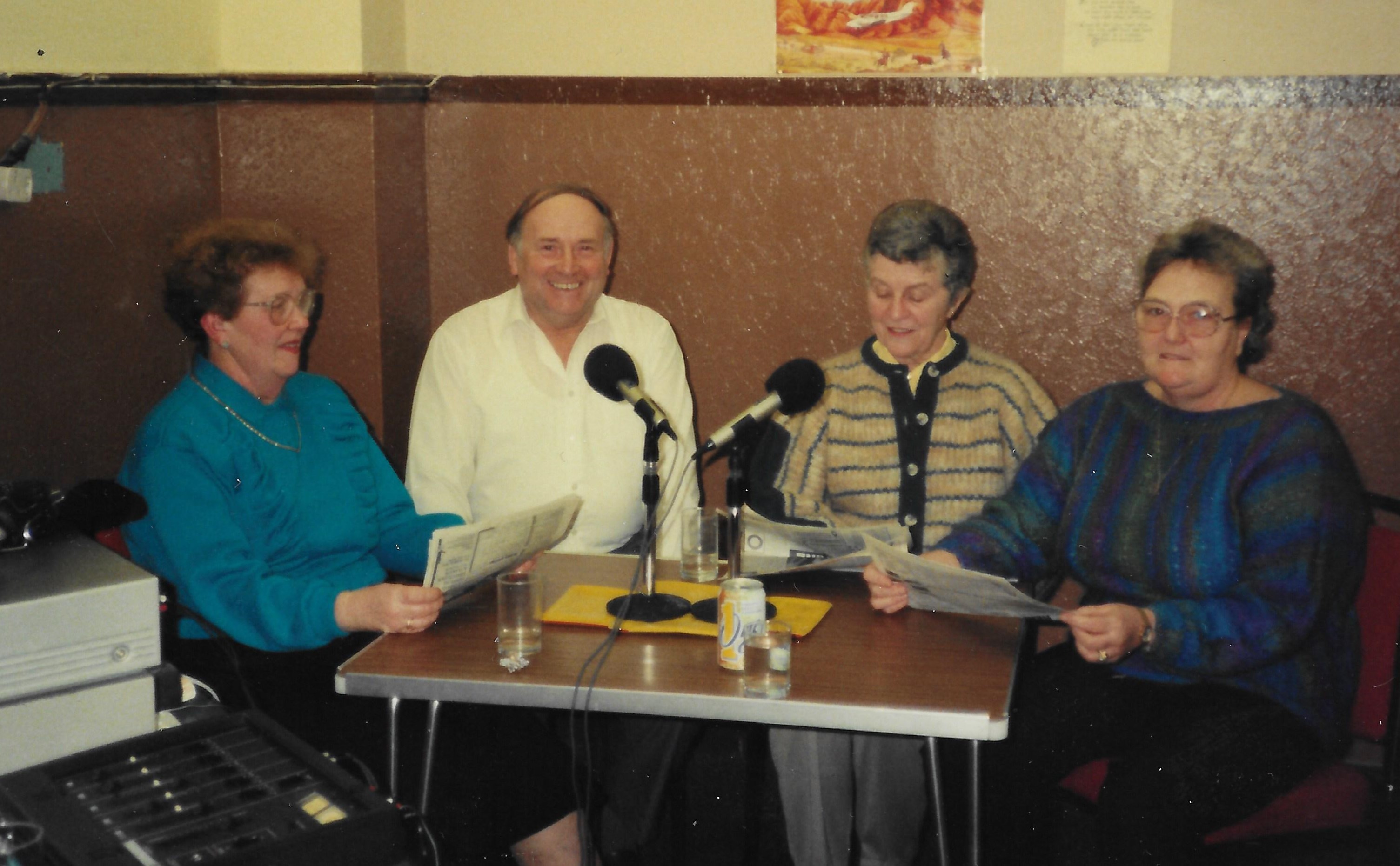 four people sitting round a table recording Bankie Talks
