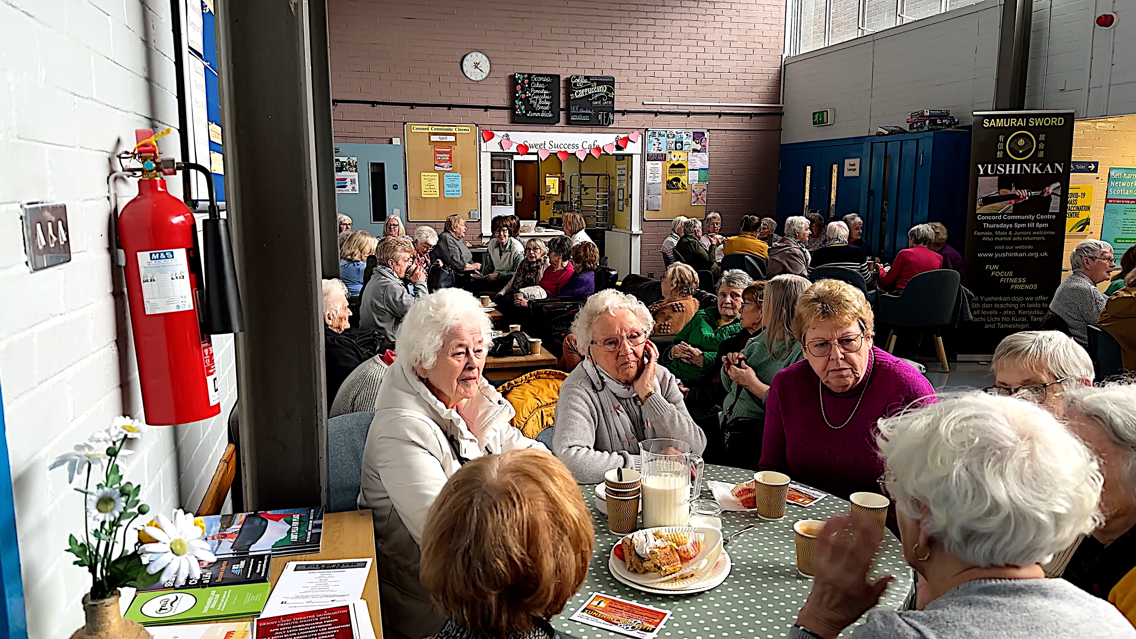 People sitting at round tables eating food