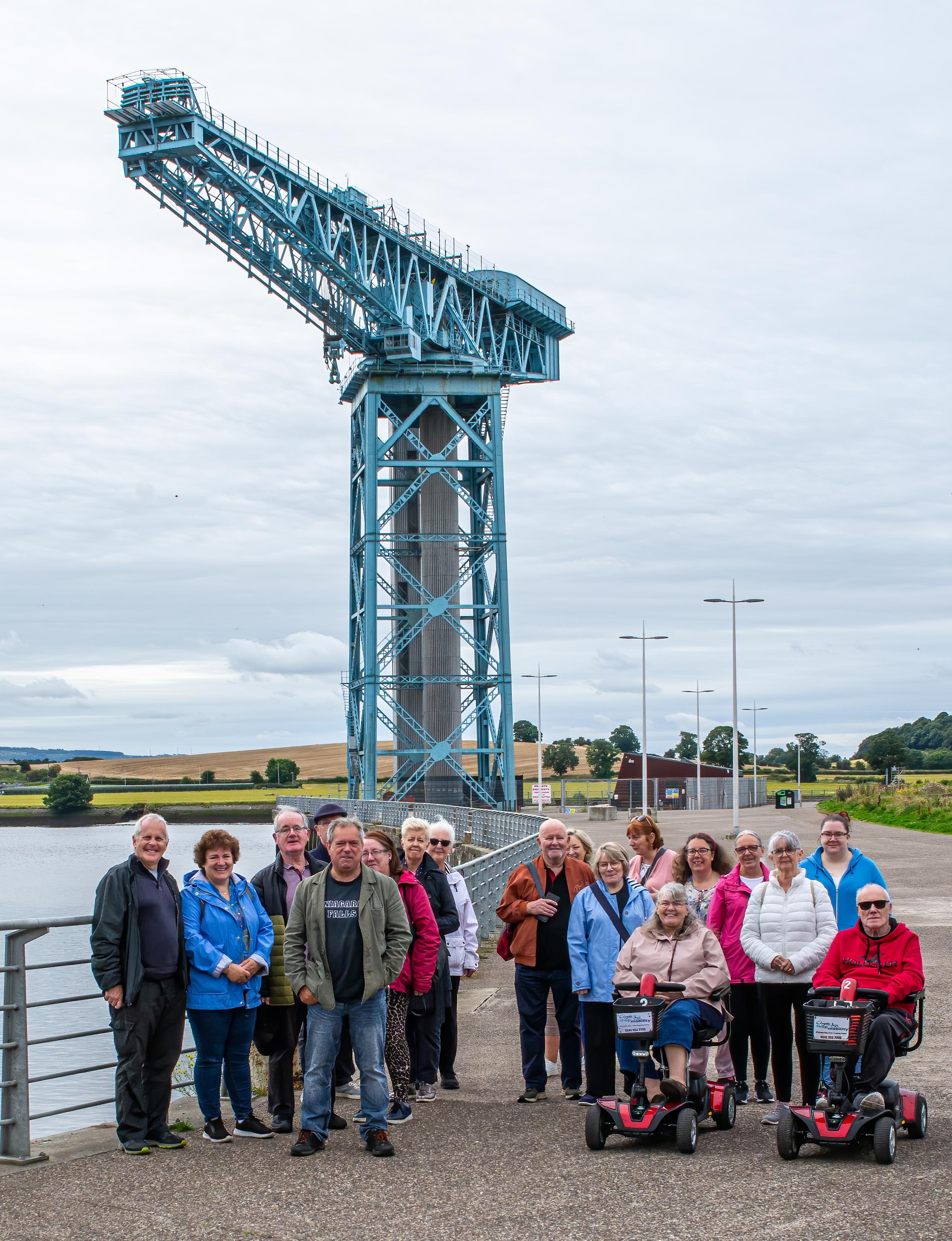 group of people standing in front of Titan Crane, Clydebank.
