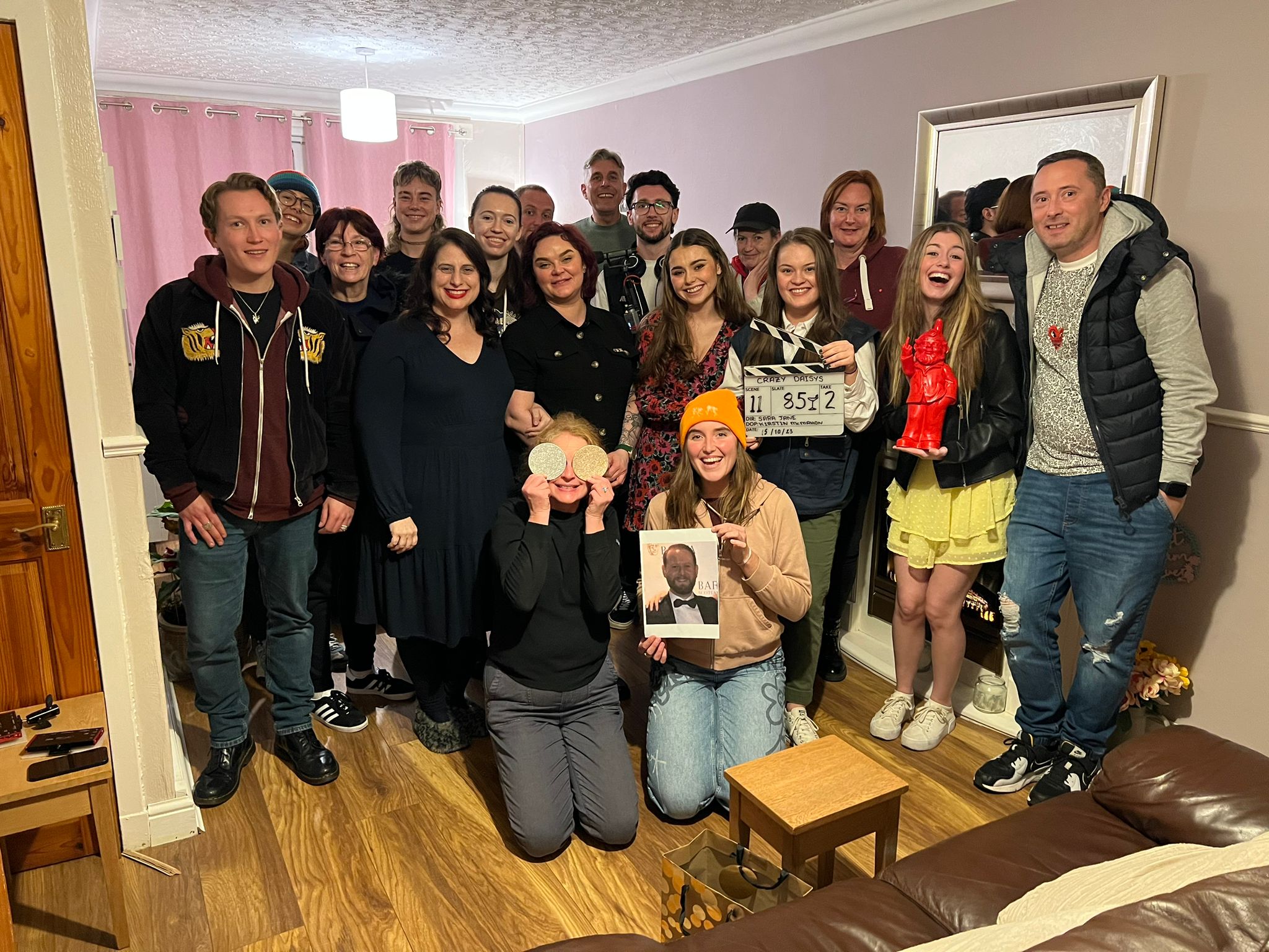 Cast and Crew together in a huddle