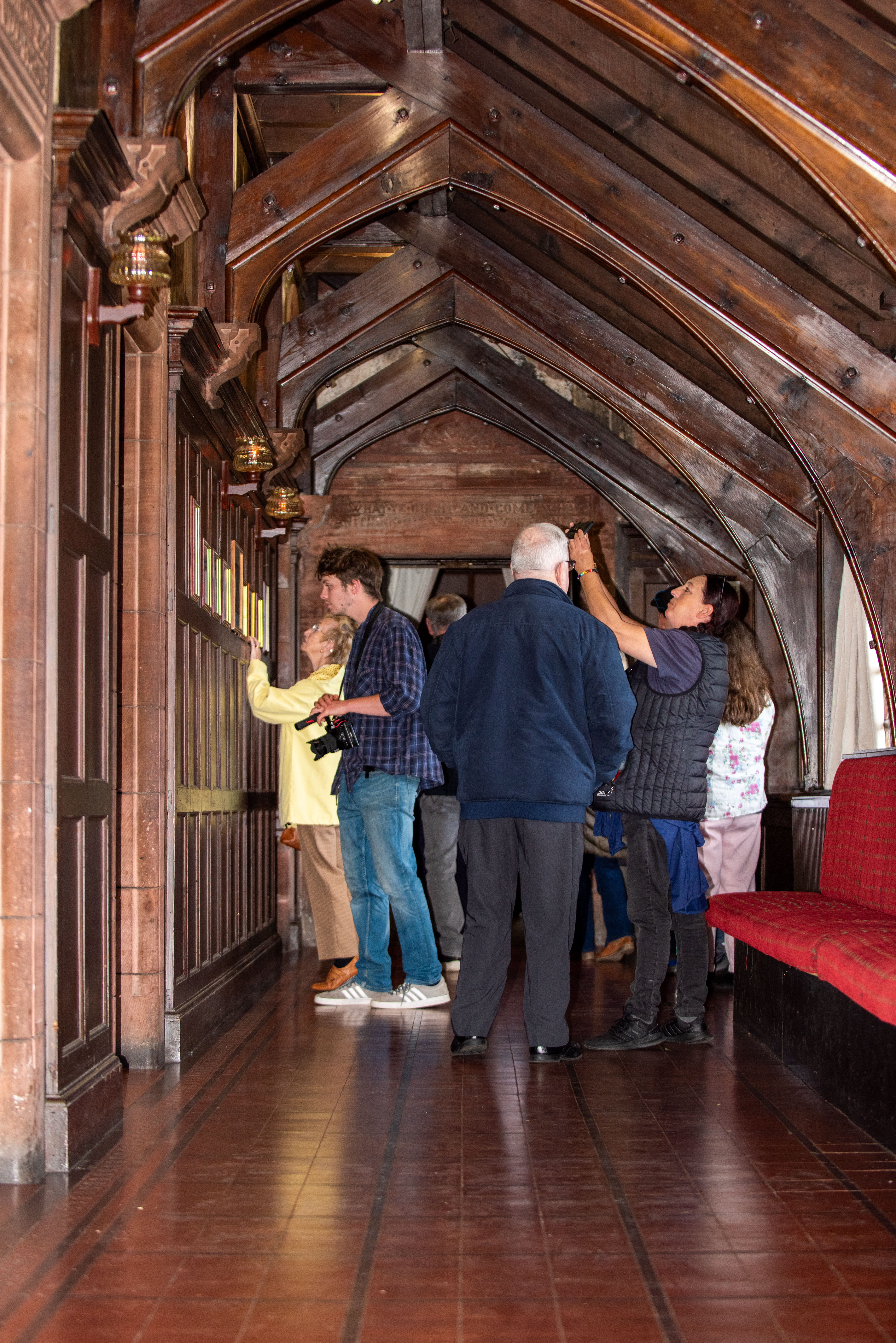 group of people inside Alexandria Masonic hall looking around