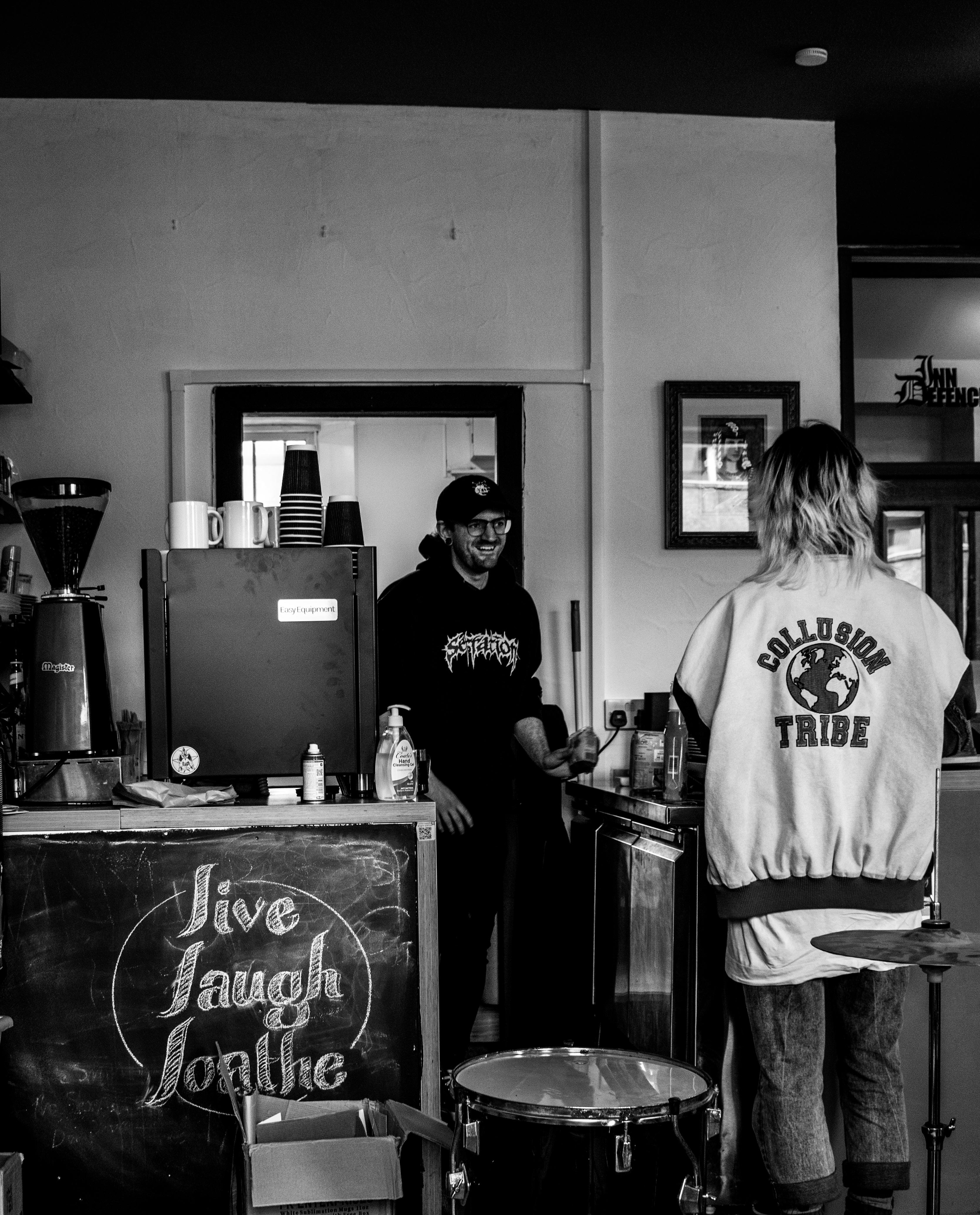 black and white photo of Darren serving customer