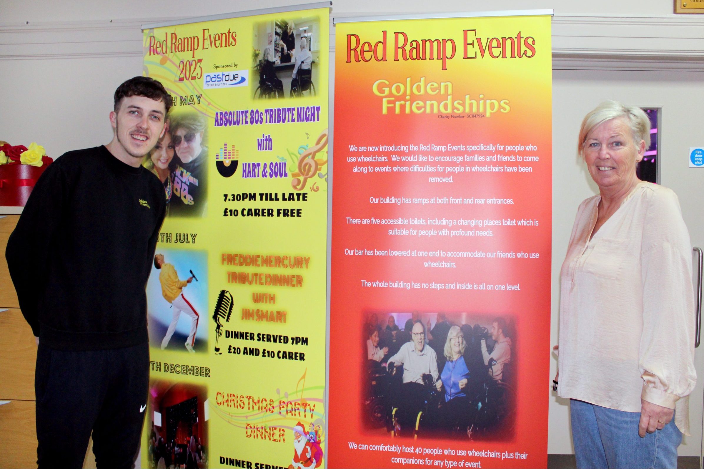 two people standing at either side of Red Ramps signs