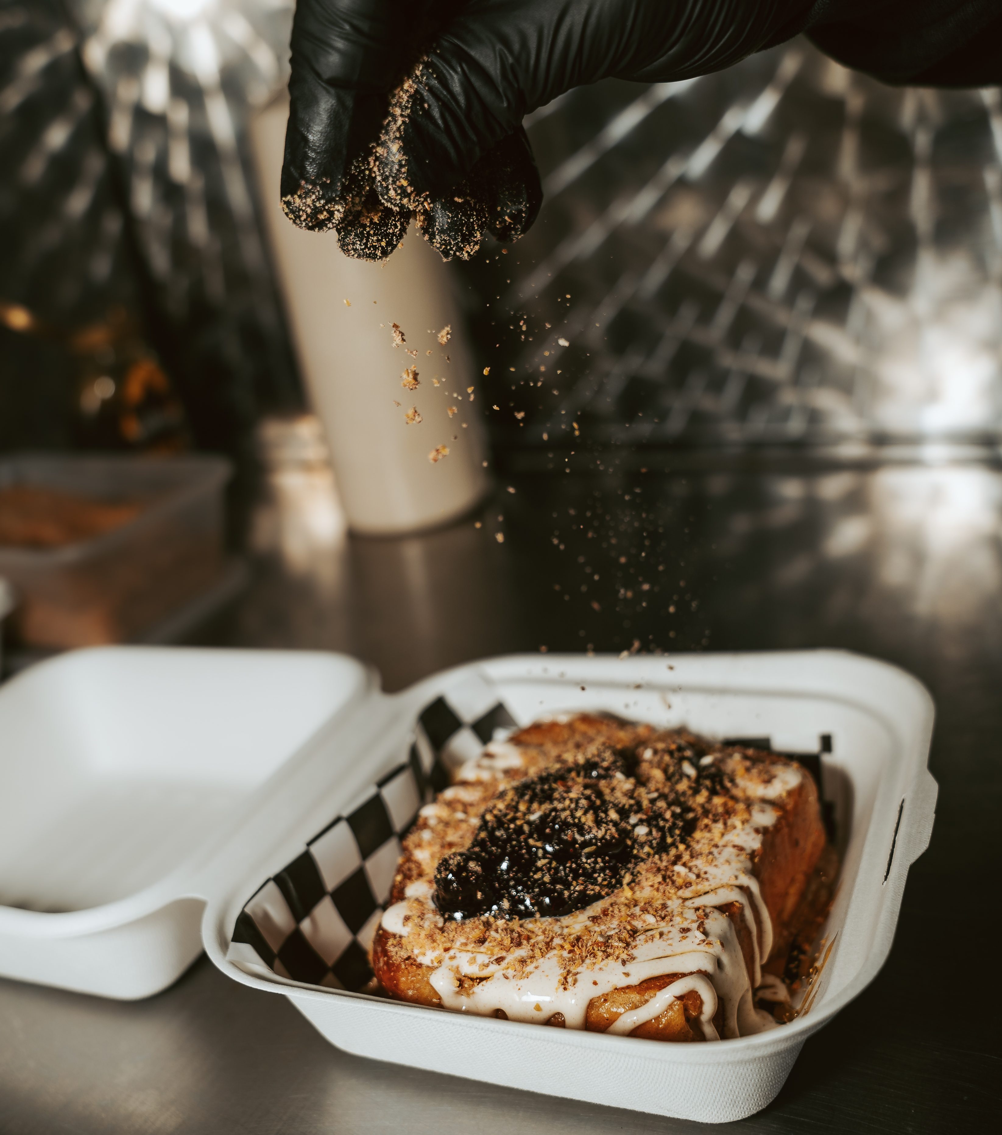 topping being sprinkled on mexican toast