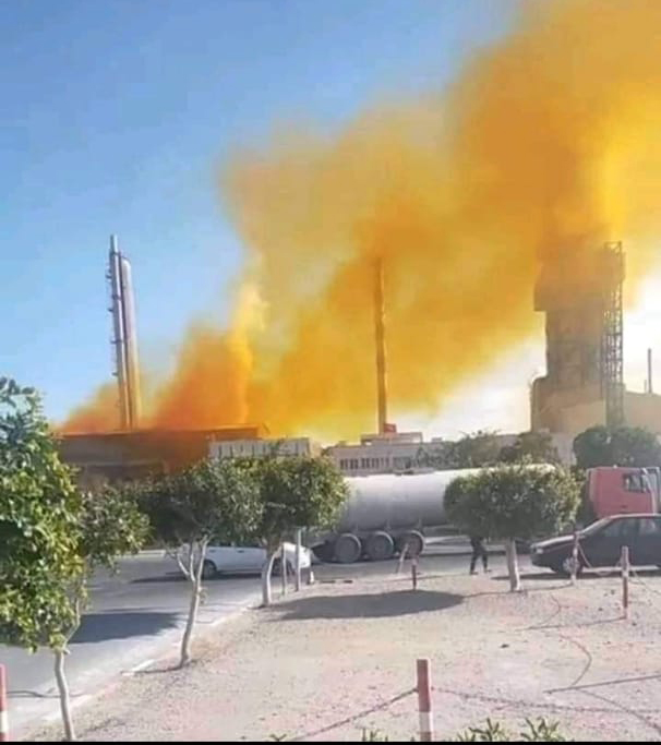 factory with poisonous fumes billowing out top