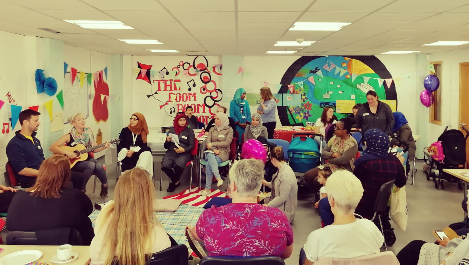 A group from Moments of Freedom sat in a circle 