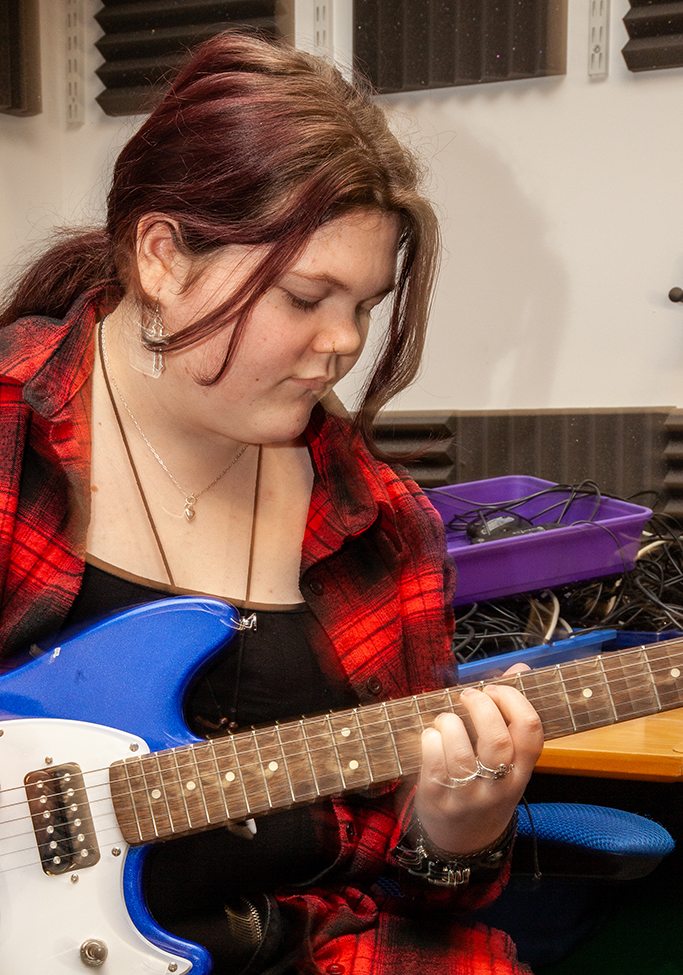 girl playing guitar
