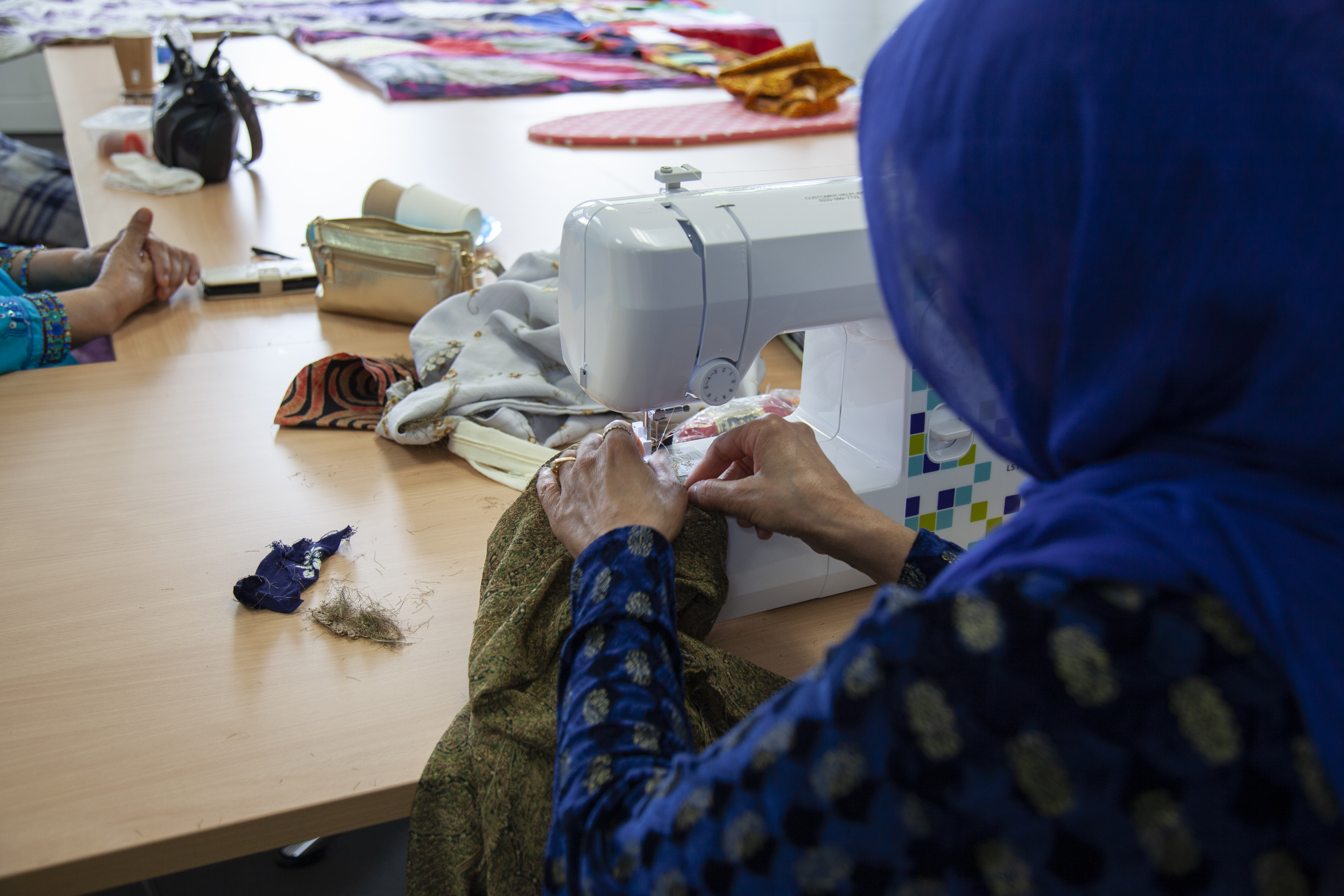 woman working on sewing machine