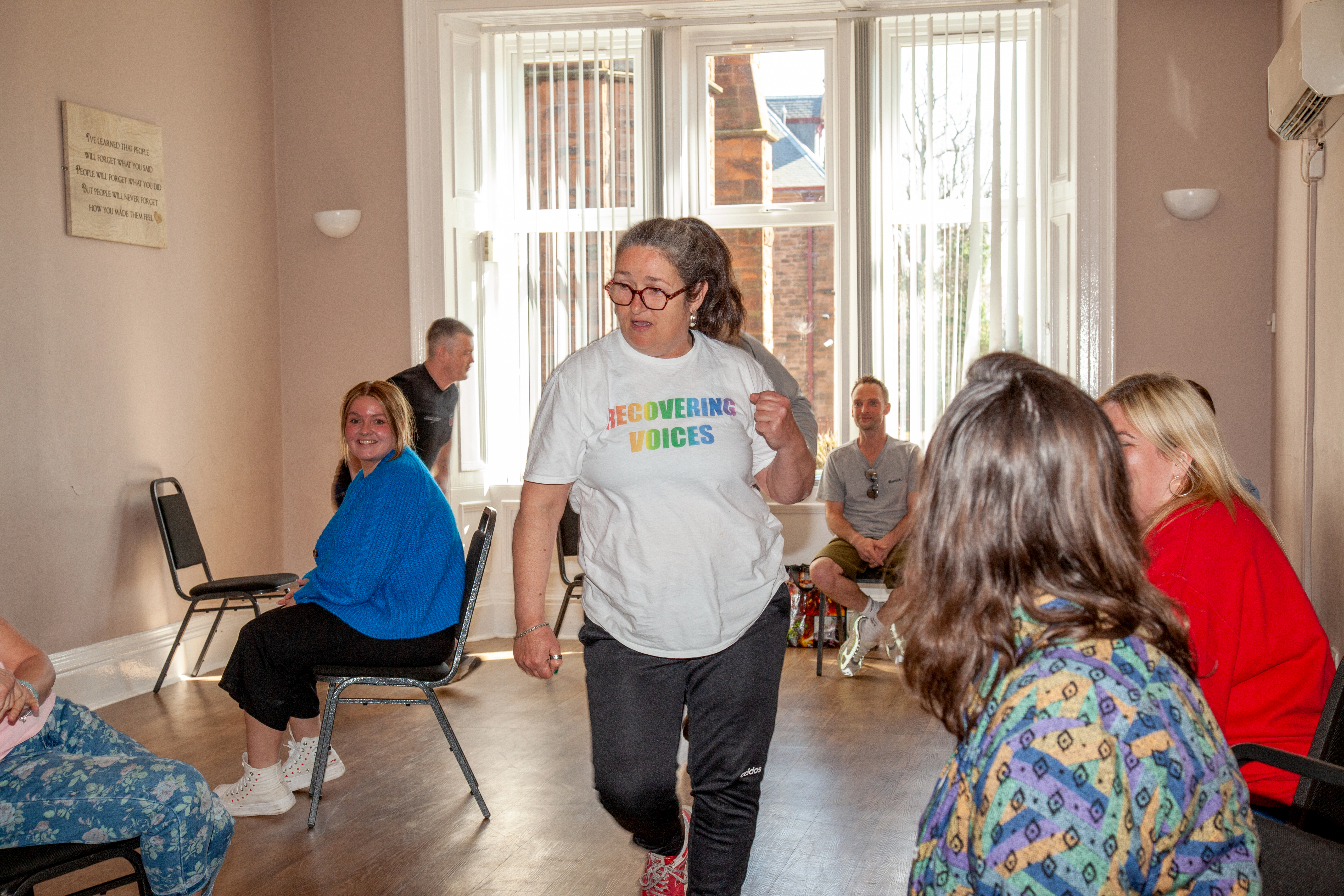 people in a room doing a team building exercise