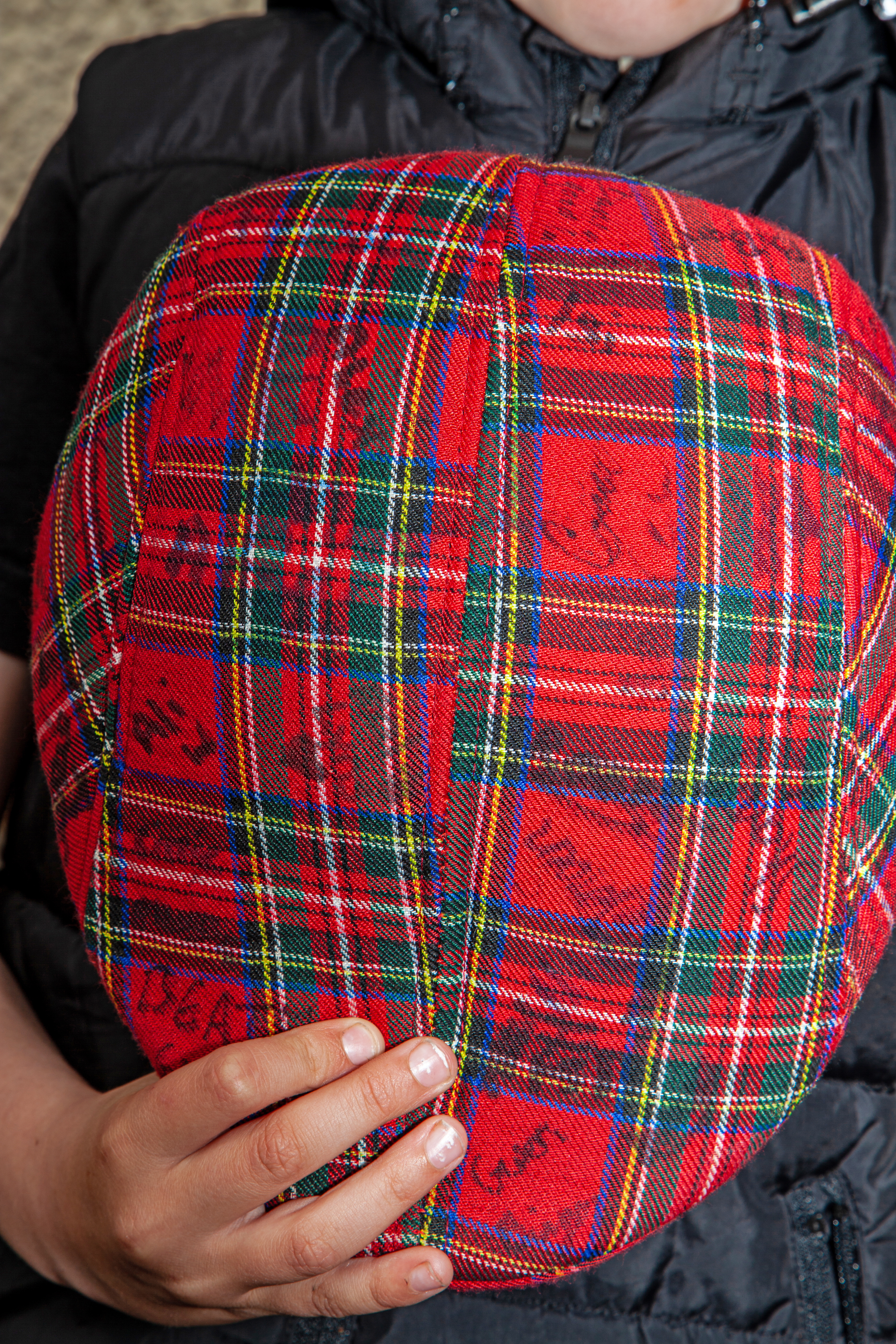 tartan hat with all the signatures on it