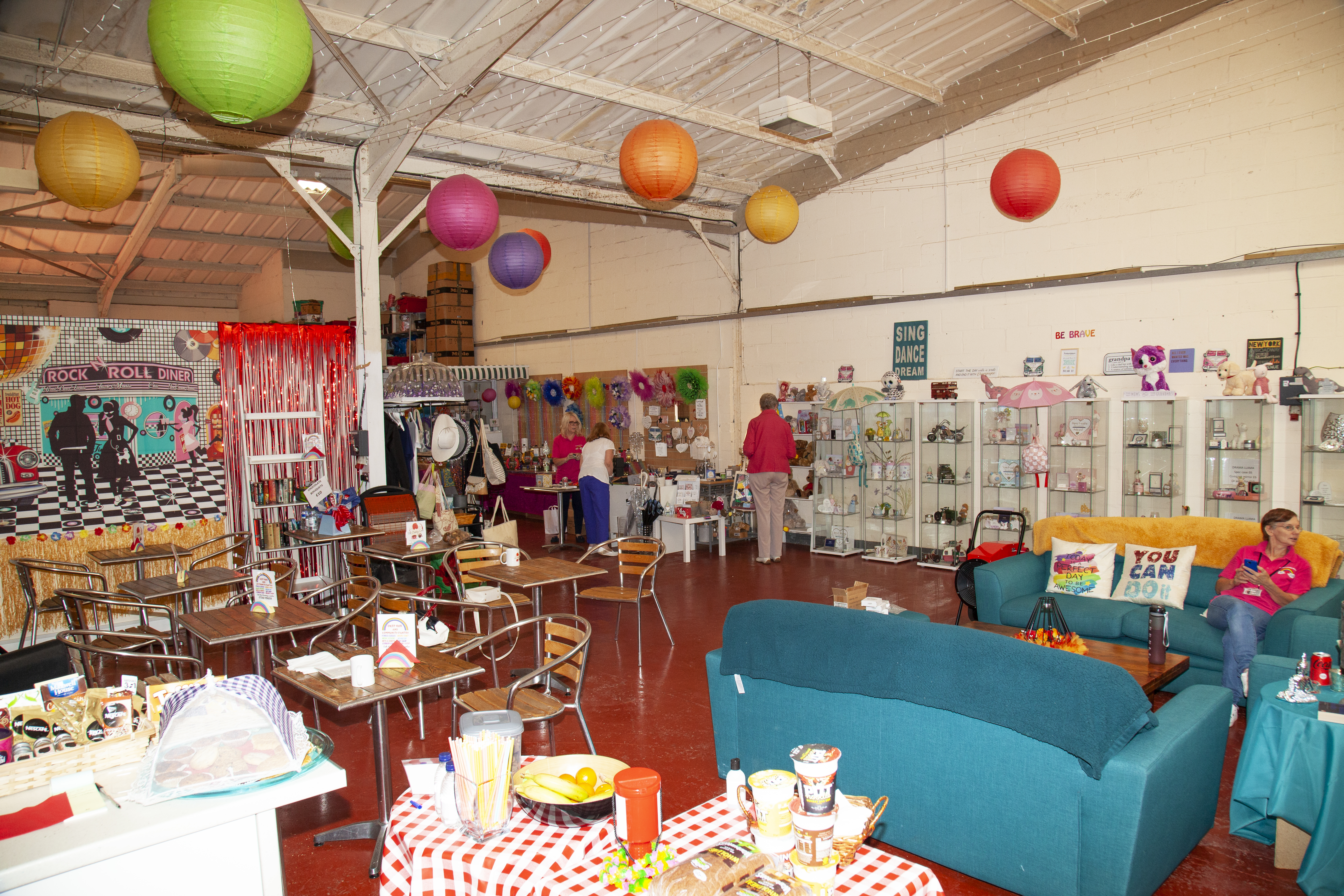 A colourful and busy image of the inside of the OKFP hall.