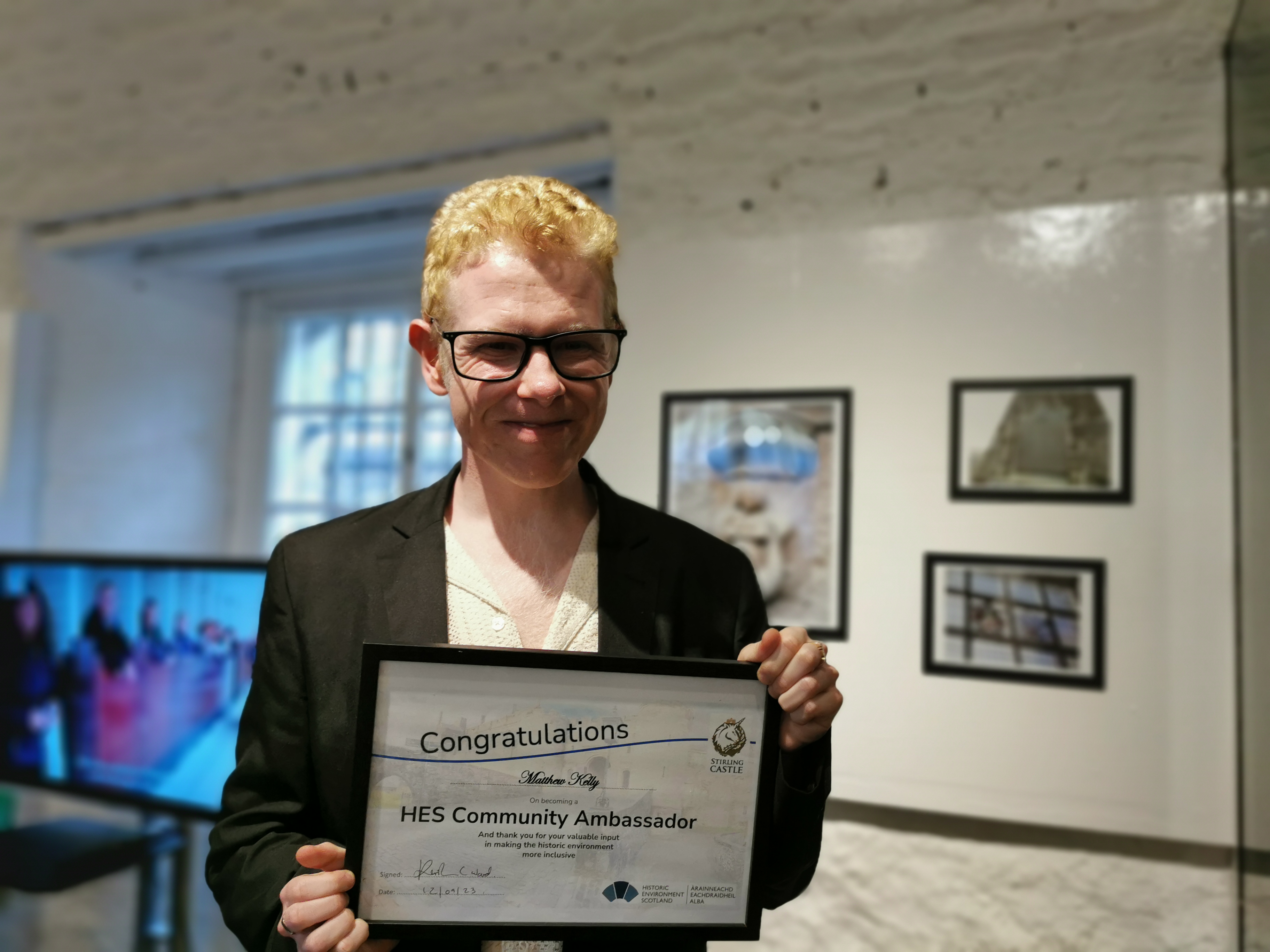 Community Ambassador holding certificate