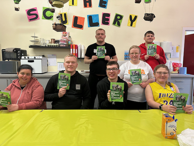 photo of Unity group holding copies of their zine