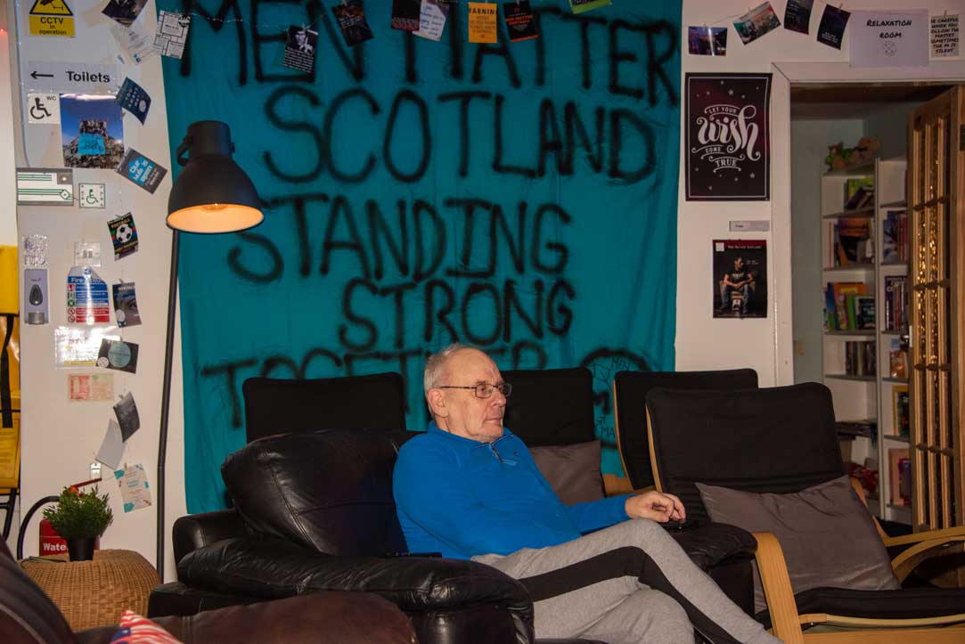 Man sitting on sofa in Men Matter hub