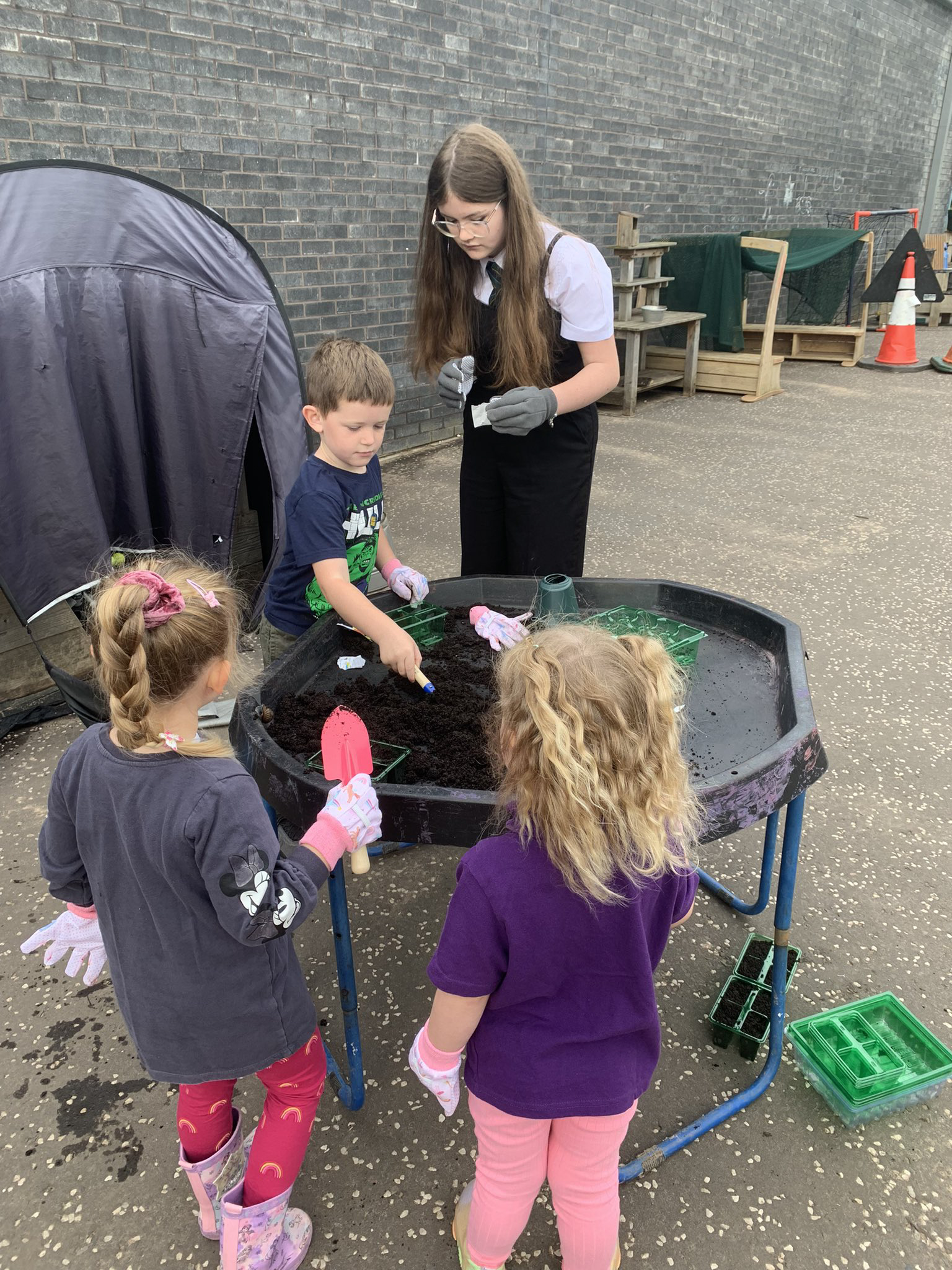 children working together in a garden