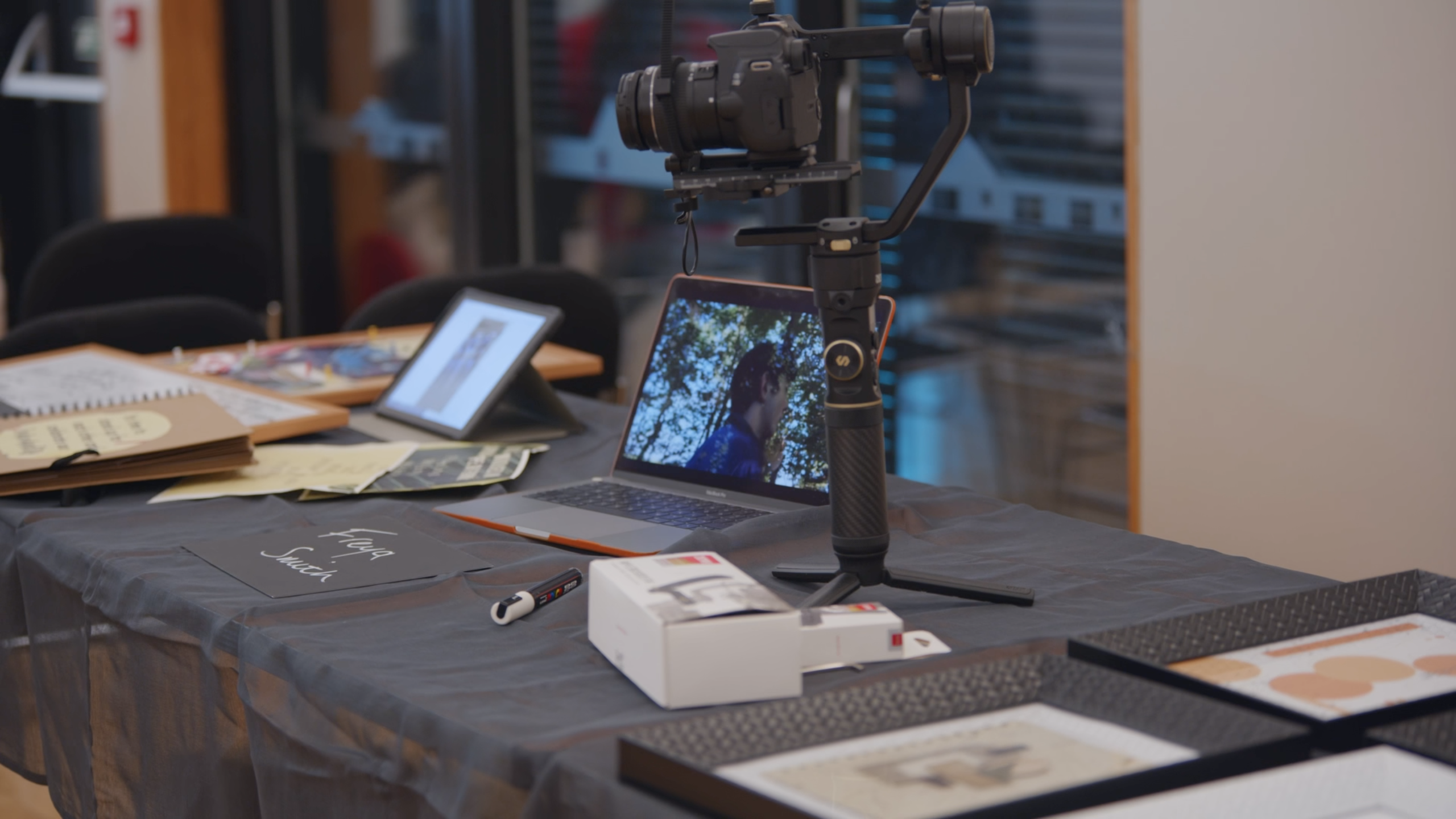 Photo of table displaying work of young person