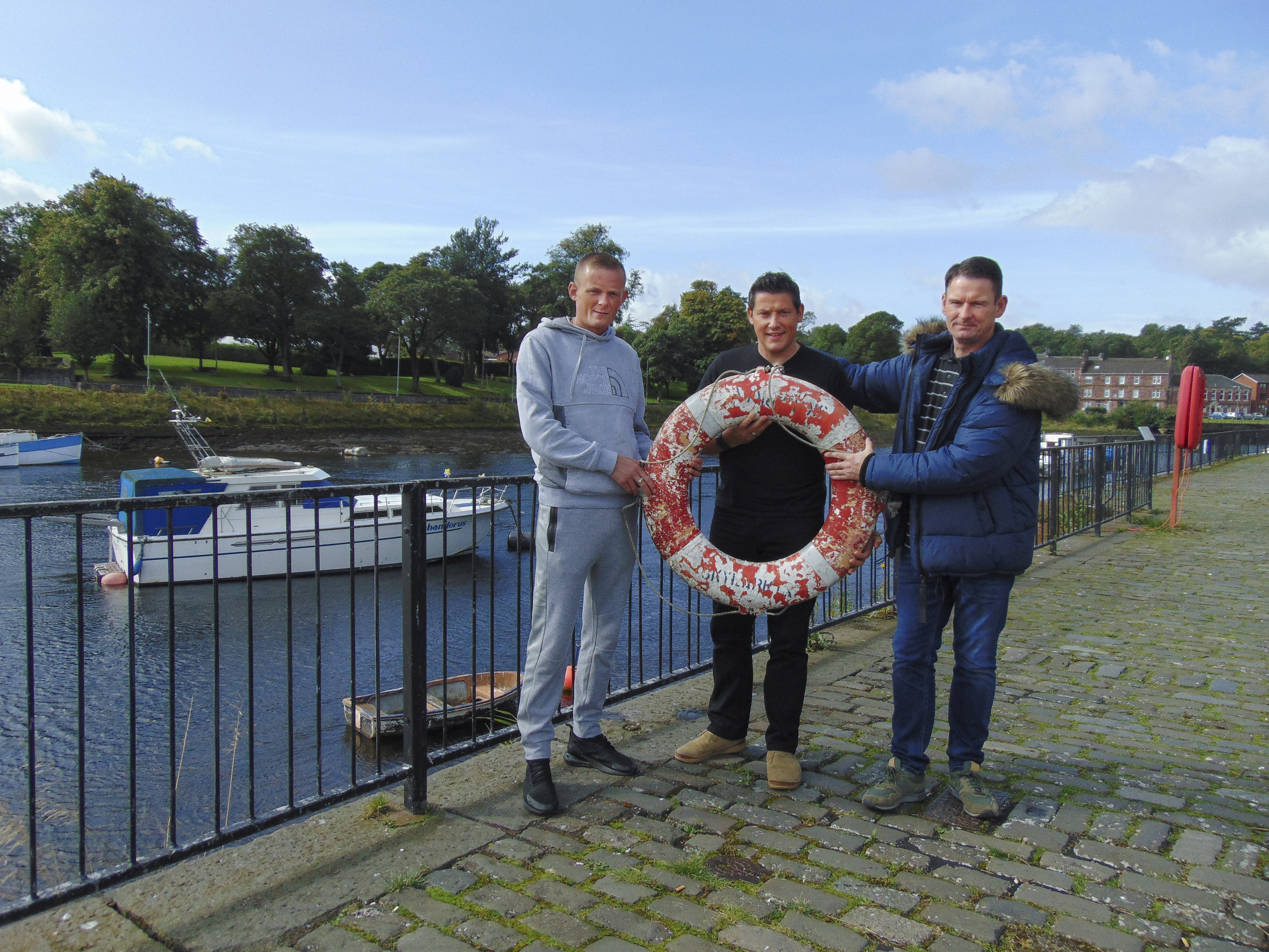 Trust Members holding Skylark Lifesaver. Photo by Katie Kennedy