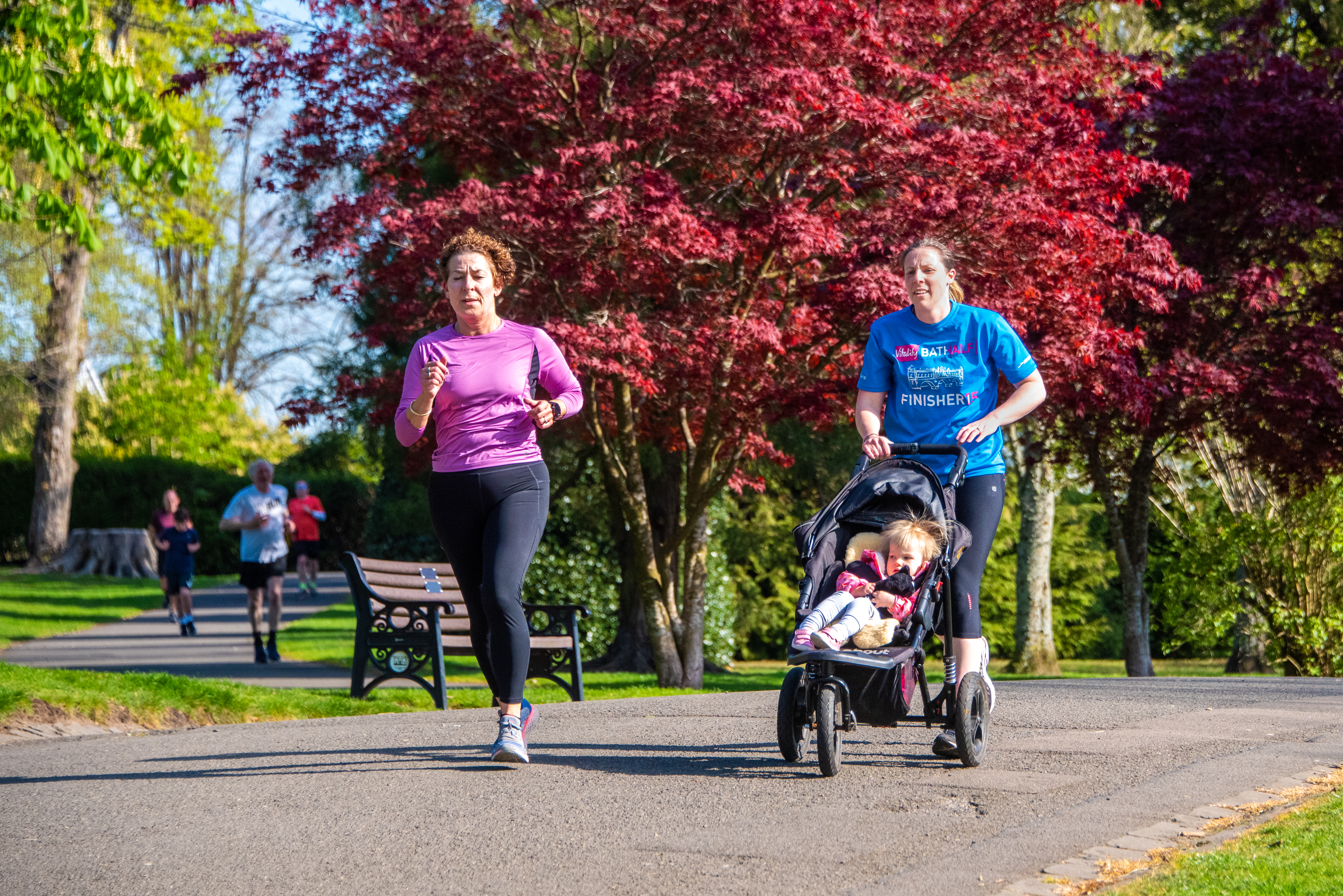 woman running with pram