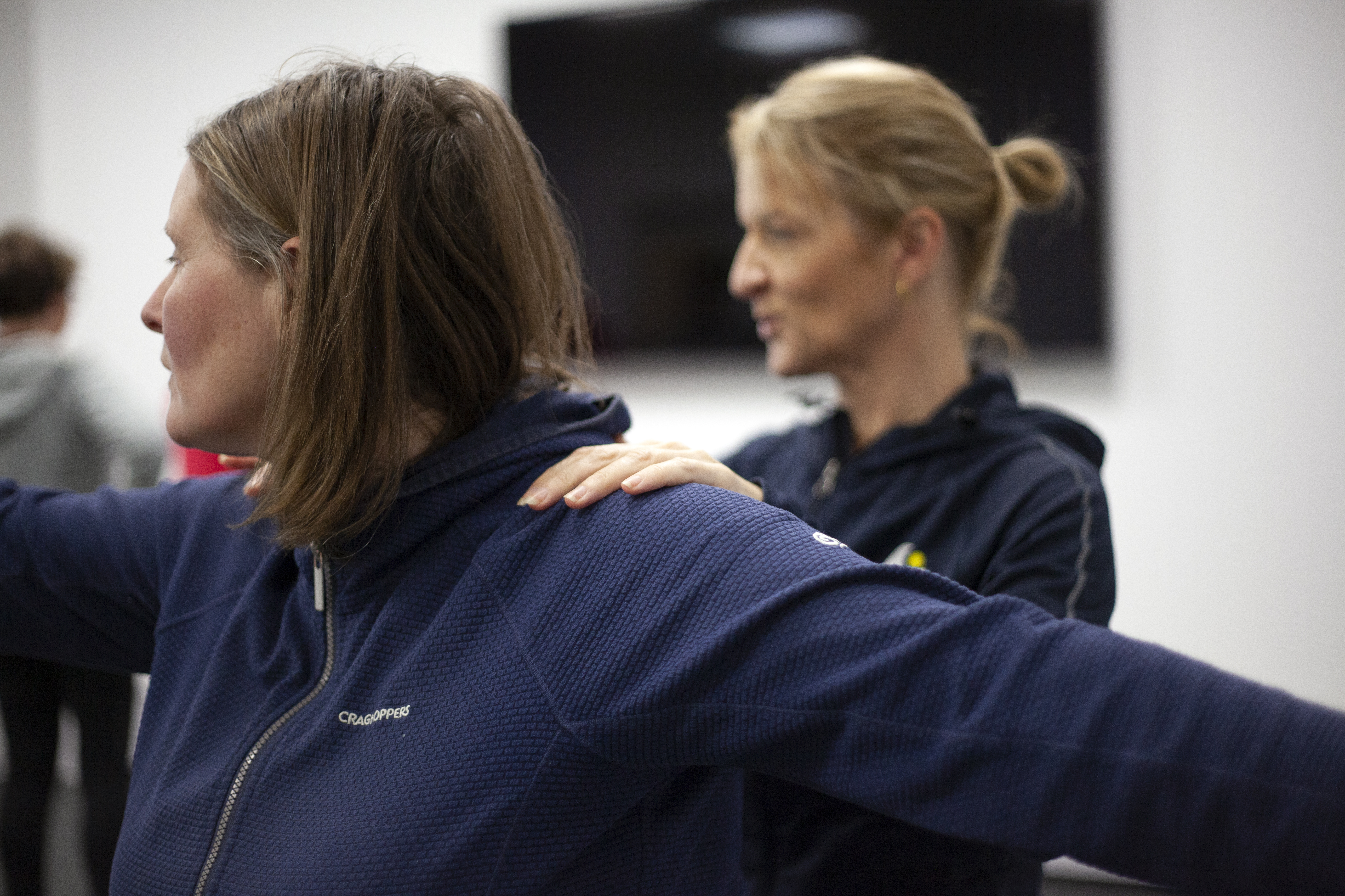 Julie assisting with yoga